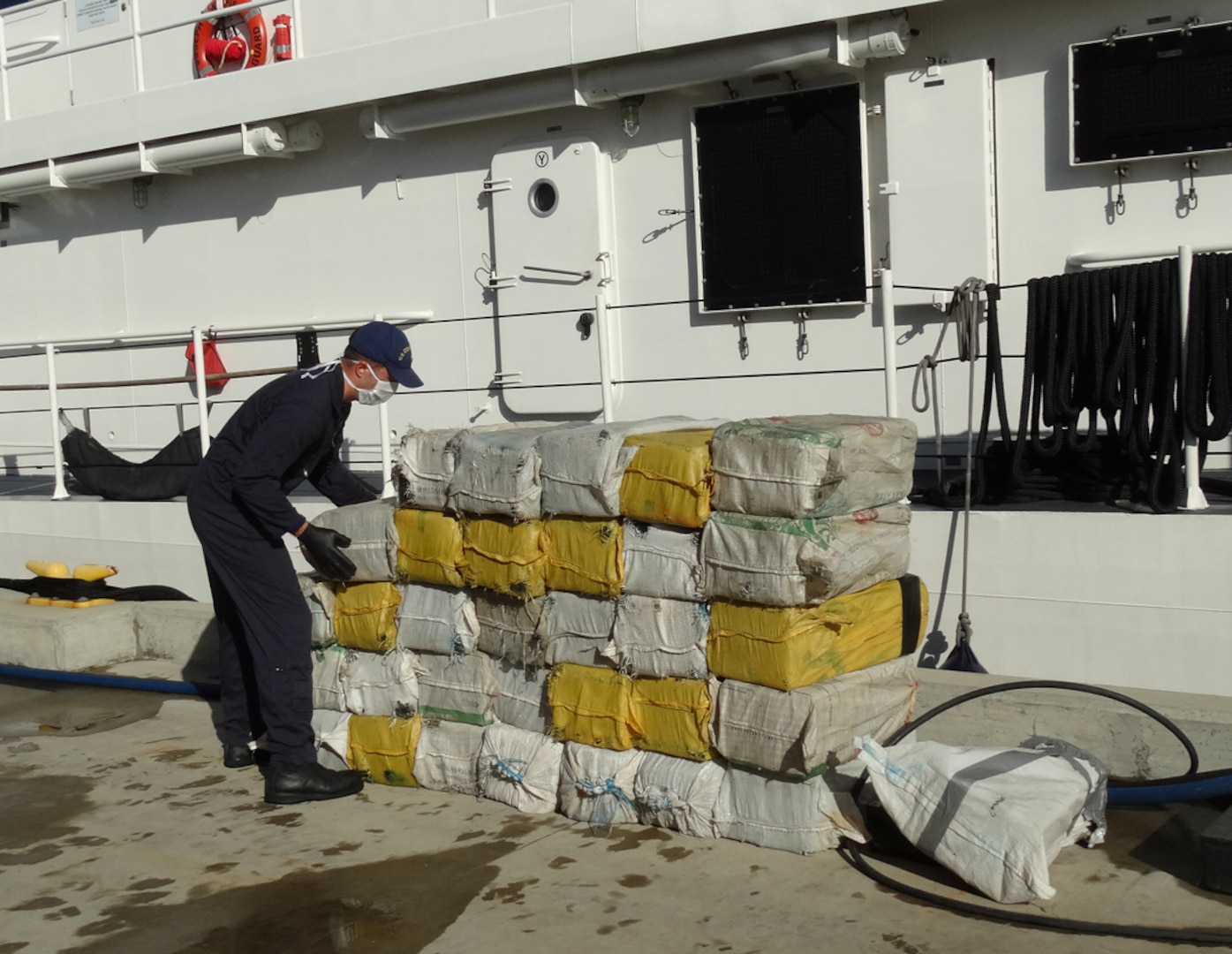 The Coast Guard transferred custody of four suspected smugglers and multiple bales of cocaine to U.S. federal law enforcement authorities at Coast Guard Sector San Juan, Puerto Rico Jan. 8, 2017. In total, 2,000 pounds of cocaine with an estimated wholesale value of $30 million were seized as a result of multi-agency law enforcement efforts in support of Operation Unified Resolve and Operation Caribbean Guard. (U.S. Coast Guard photo)