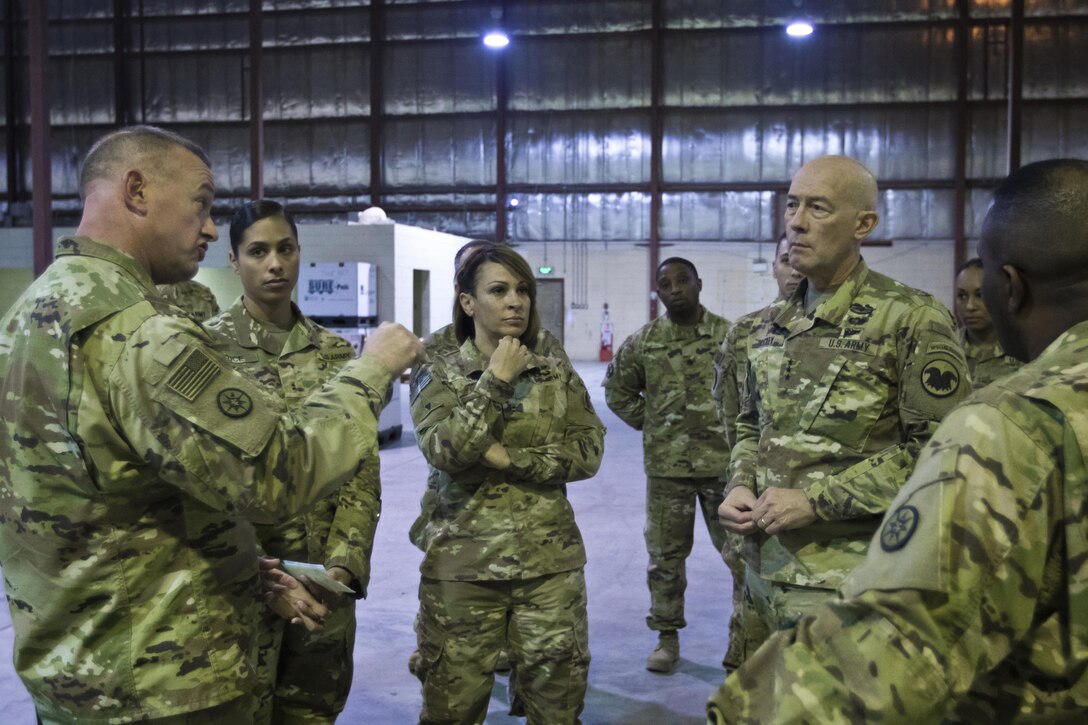 Brig. Gen. Robert D. Harter, commanding general of the 316th Sustainment Command (Expeditionary), (left), explains the process of how equipment is moved through out the U.S. Central Command (USCENTCOM) Area of Responsibility (AOR) to U.S. Army Reserve Commanding General, LTG Charles D. Luckey, (right), during a tour the Iraq Train and Equipment Fund (ITEF) warehouse at Camp Arifjan, Kuwait, Jan. 4, 2017. 