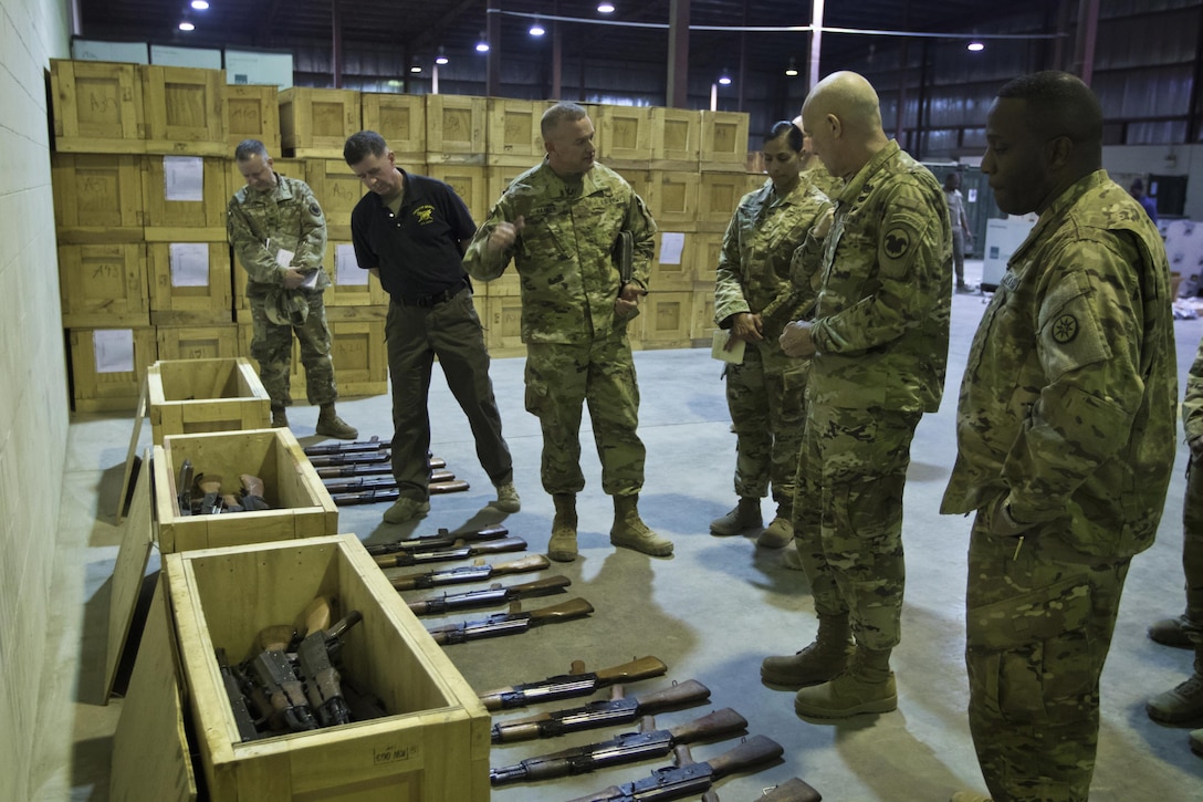 Brig. Gen. Robert D. Harter, commanding general of the 316th Sustainment Command (Expeditionary), (left), explains the process of how equipment is moved through out the U.S. Central Command (USCENTCOM) Area of Responsibility (AOR) to U.S. Army Reserve Commanding General, LTG  Charles D. Luckey, (right), during a tour the Iraq Train and Equipment Fund (ITEF) warehouse at Camp Arifjan, Kuwait, Jan. 4, 2017. 