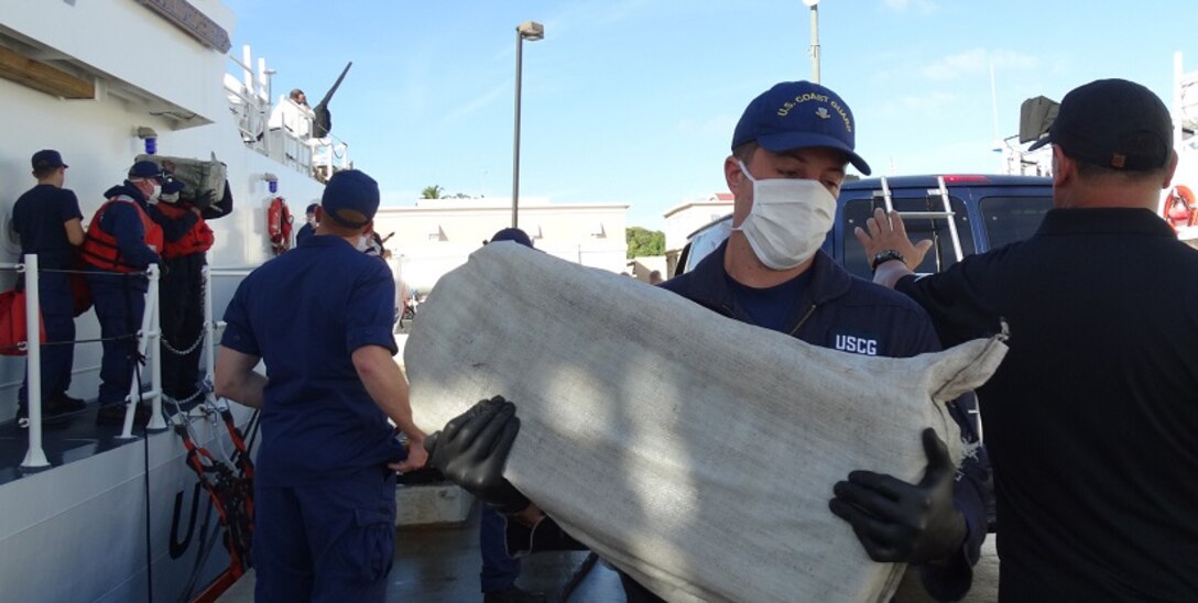The Coast Guard transferred custody of four suspected smugglers and multiple bales of cocaine to U.S. federal law enforcement authorities at Coast Guard Sector San Juan, Puerto Rico Jan. 8, 2017. In total, 2,000 pounds of cocaine with an estimated wholesale value of $30 million were seized as a result of multi-agency law enforcement efforts in support of Operation Unified Resolve and Operation Caribbean Guard. (U.S. Coast Guard photo)