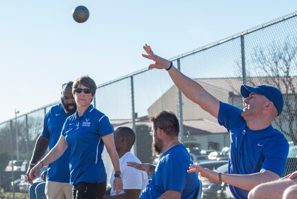 Air Force Wounded Warriors learn how to throw shot put during the 2017 Air Force Wounded Warrior Warrior CARE event Jan. 10, 2017, at JBSA-Randolph, Texas. The goal of the Warrior CARE event is to provide wellness events for seriously wounded, ill and injured military members, veterans and their caregivers.(U.S. Air Force photo by Senior Airman Stormy Archer)	