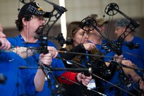 Air Force Wounded Warriors learn archery during the 2017 Air Force Wounded Warrior Warrior CARE event Jan. 10, 2017, at JBSA-Randolph, Texas. The goal of the Warrior CARE event is to provide wellness events for seriously wounded, ill and injured military members, veterans and their caregivers. 