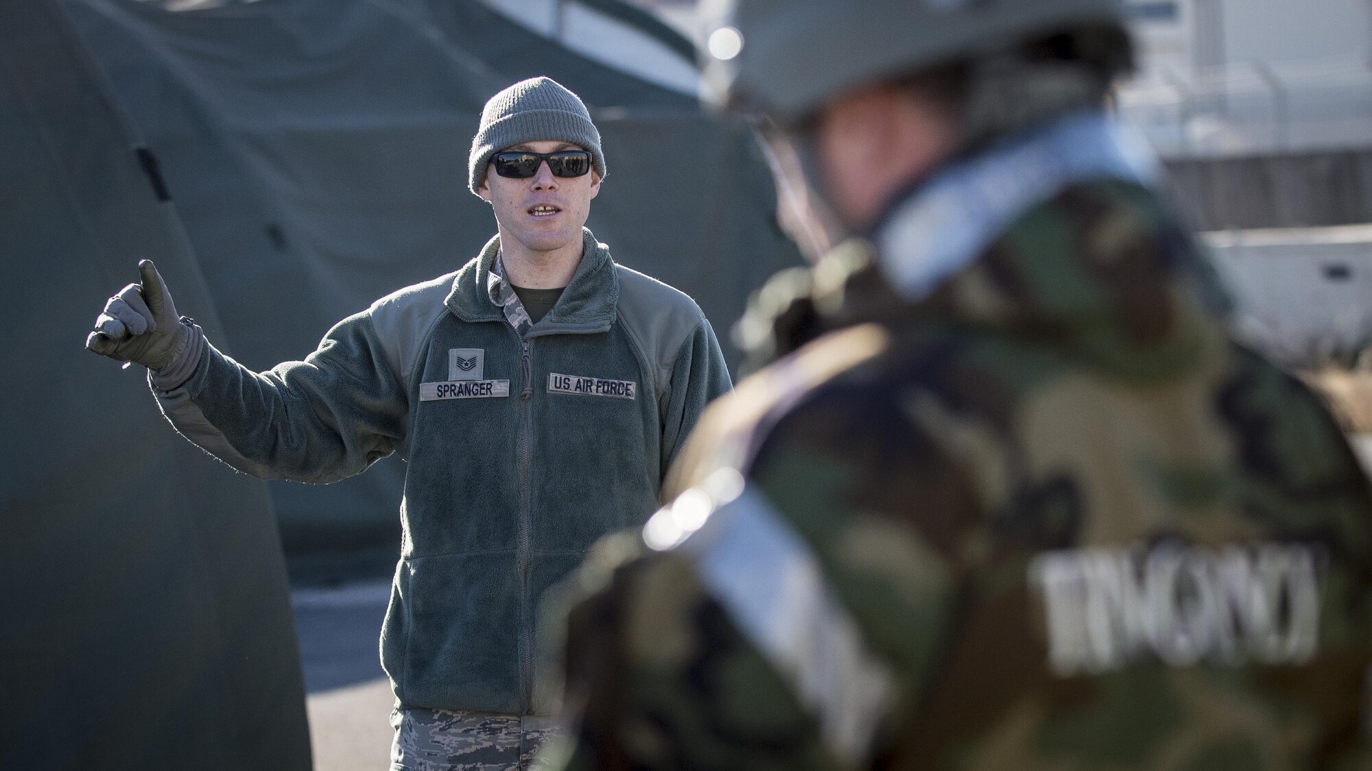 Tech. Sgt. Kevin Spranger, 31st Civil Engineer Squadron Emergency Management plans and operations NCO in charge, instructs Airmen from the 31st Maintenance Group during an Expeditionary Skills Rodeo event at Aviano Air Base, Italy on Jan. 6, 2017. Spranger hosted a Chemical, Biological, Radiological, Nuclear and High Yield Explosives defense survival skills course during the event. (U.S. Air Force photo by Senior Airman Cory W. Bush)