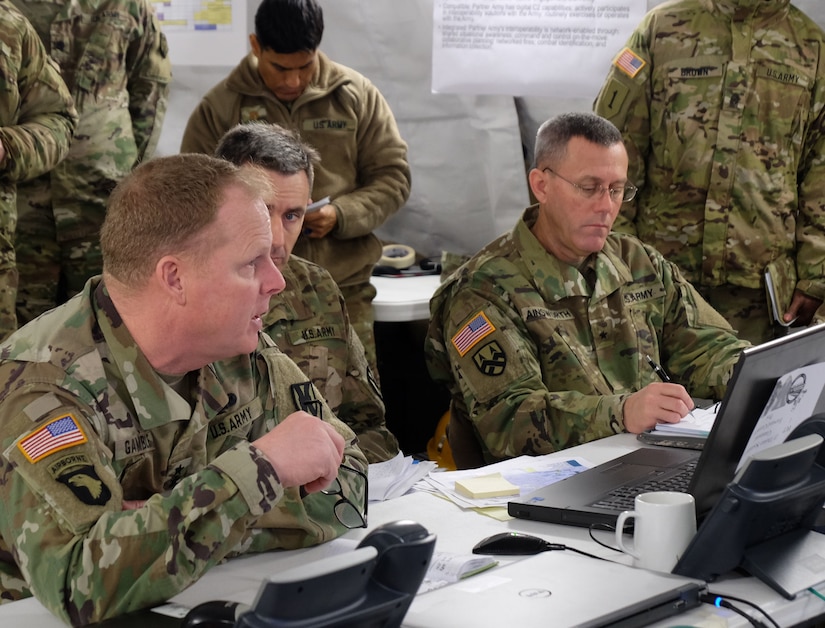 GARLSTEDT, Germany – Left to right, Commanding General Maj. Gen. Duane A. Gamble, 21st Theater Sustainment Command, Col. Jeffrey Knight, chief of operations, 21st TSC and Brig. Gen. Steven W. Ainsworth, commanding general, 7th Mission Support Command, listen during the 21st TSC commander’s update brief, Jan. 7, 2017. Six Army Reserve Soldiers and two civilians from the 7th Mission Support Command are providing logistical and operational support to the 21st Theater Sustainment Command’s forward command post during reception staging, onward movement and integration of the 4th Infantry Division’s 3rd Armored Brigade Combat Team as part of U.S. Army Europe’s “Operation Atlantic Resolve,” Jan. 3-23.