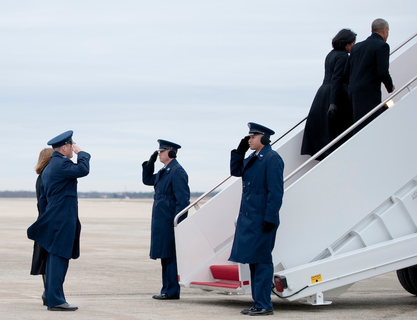 Col. Christopher Thompson (left), 89th Airlift Wing vice commander, salutes President Barack Obama and first lady, Michelle Obama, as they ascend the stairs to Air Force One at Joint Base Andrews, Md., Jan. 10, 2017. The president’s next scheduled flight on Air Force One is Jan. 20, Inauguration Day, when his successor, president-elect Donald Trump, takes the oath of office. (U.S. Air Force photo by Staff Sgt. Joe Yanik) 