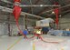 Containment pools (bottom right) were built with wood framing and plastic sheets to aid in water collection during the test. This is a different approach from previous tests where water or fire-fighting foam was released into the hangar after all equipment was manually covered up with plastic. (U.S. Air Force photo/Kenji Thuloweit)