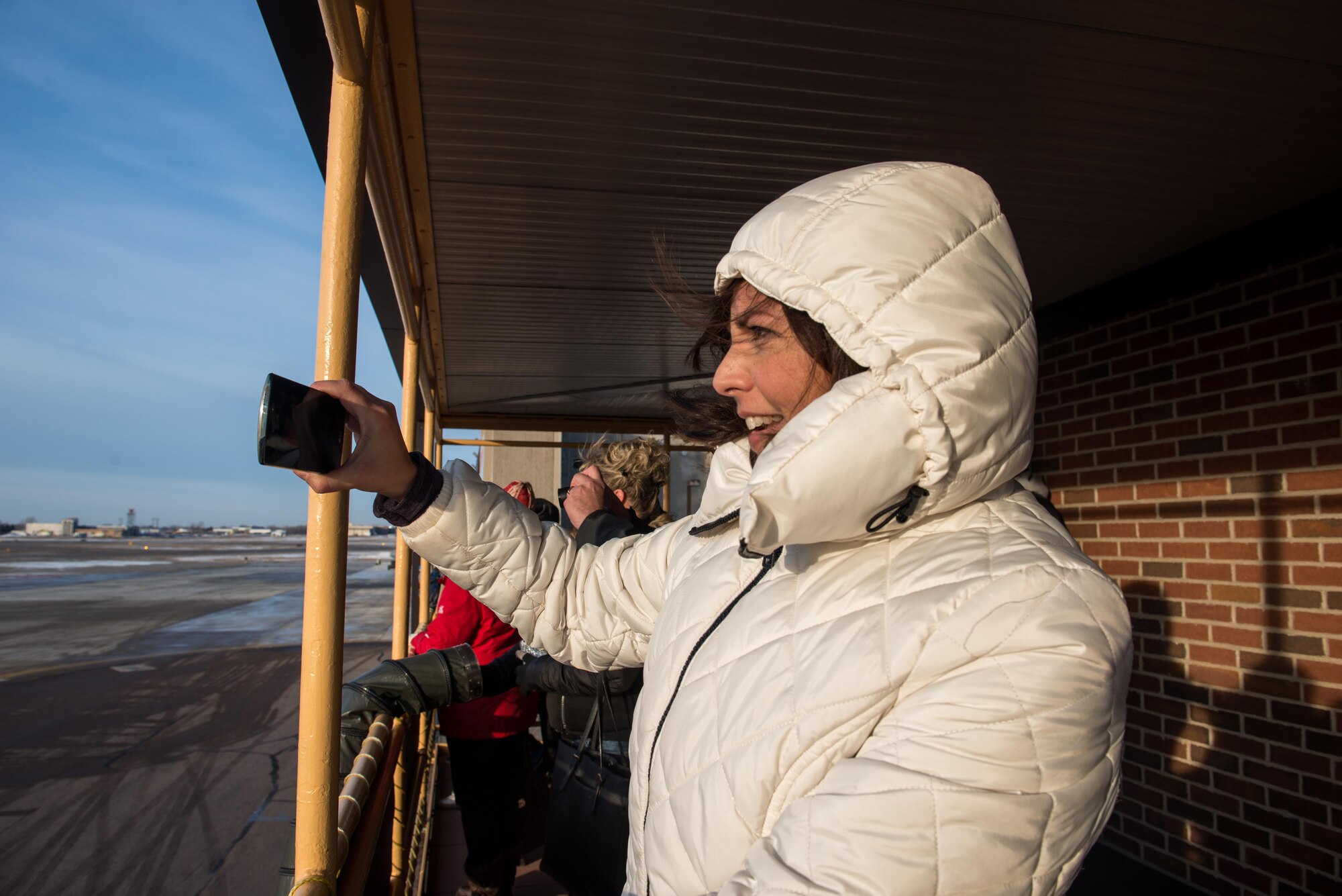 Michelle Will records a C-130 as it taxis out as part of the 934th Airlift Wing deployment Jan. 8.