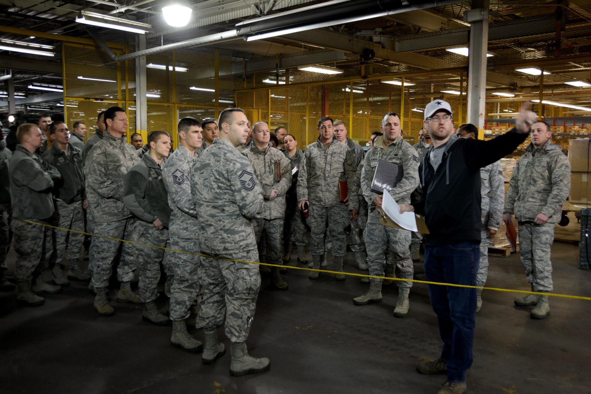 A contractor with the 72nd Logistics Readiness squadron directs members of the 507th Air Refueling Wing on where to place their mobility bags during a deployment exercise Jan. 8, 2017, at Tinker Air Force Base, Okla. Reservists with the 507th Air Refueling Wing participated in the exercise in preparation for the upcoming nuclear operational readiness inspection in March 2016. (U.S. Air Force photo/Tech Sgt. Lauren Gleason)