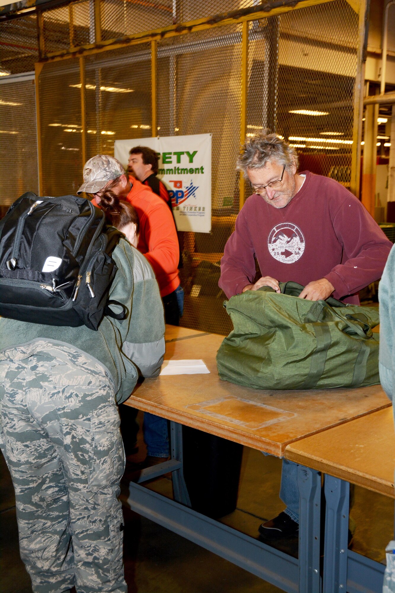 A contractor with the 72nd Logistics Readiness Squadron issues a mobility bag to a Reservist with the 507th Air Refueling Wing during a deployment exercise Jan. 8, 2017, at Tinker Air Force Base, Okla. Reservists with the 507th Air Refueling Wing participated in the exercise in preparation for the upcoming nuclear operational readiness inspection in March 2016. (U.S. Air Force photo/Tech Sgt. Lauren Gleason)