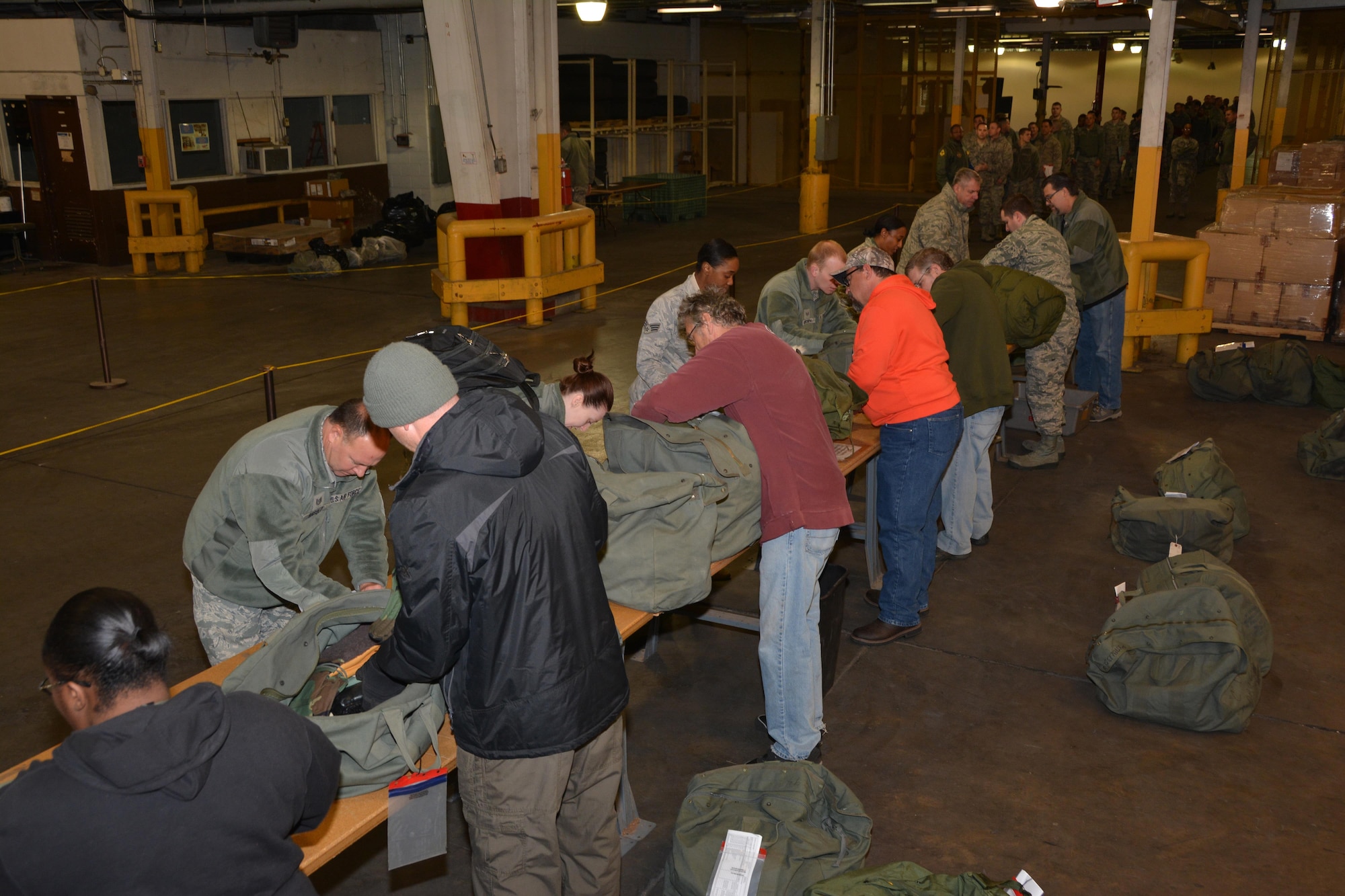 Contractors with the 72nd Logistics Readiness Squadron issue mobility bags to Reservists with the 507th Air Refueling Wing during a deployment exercise Jan. 8, 2017, at Tinker Air Force Base, Okla. Reservists with the 507th Air Refueling Wing participated in the exercise in preparation for the upcoming nuclear operational readiness inspection in March 2016. (U.S. Air Force photo/Tech Sgt. Lauren Gleason)