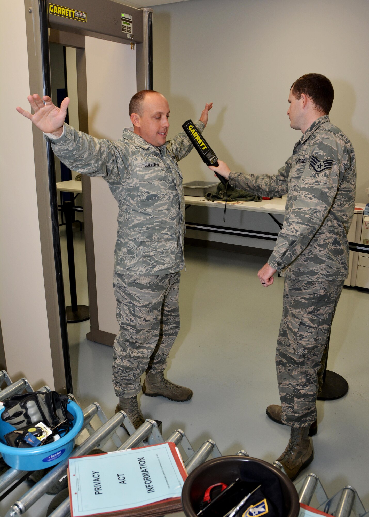 Staff Sgt. Bryan Tisdale, an aircraft service supervisor with the 72nd Logistics Readiness Squadron, waves a hand magnetometer across the arm of Senior Airman Robert Golliver of the 507th Security Forces Squadron at the security checkpoint during an exercise Jan. 8, 2017, at Tinker Air Force Base, Okla. Reservists with the 507th Air Refueling Wing participated in the exercise in preparation for the upcoming nuclear operational readiness inspection in March 2016. (U.S. Air Force photo/Tech Sgt. Lauren Gleason)