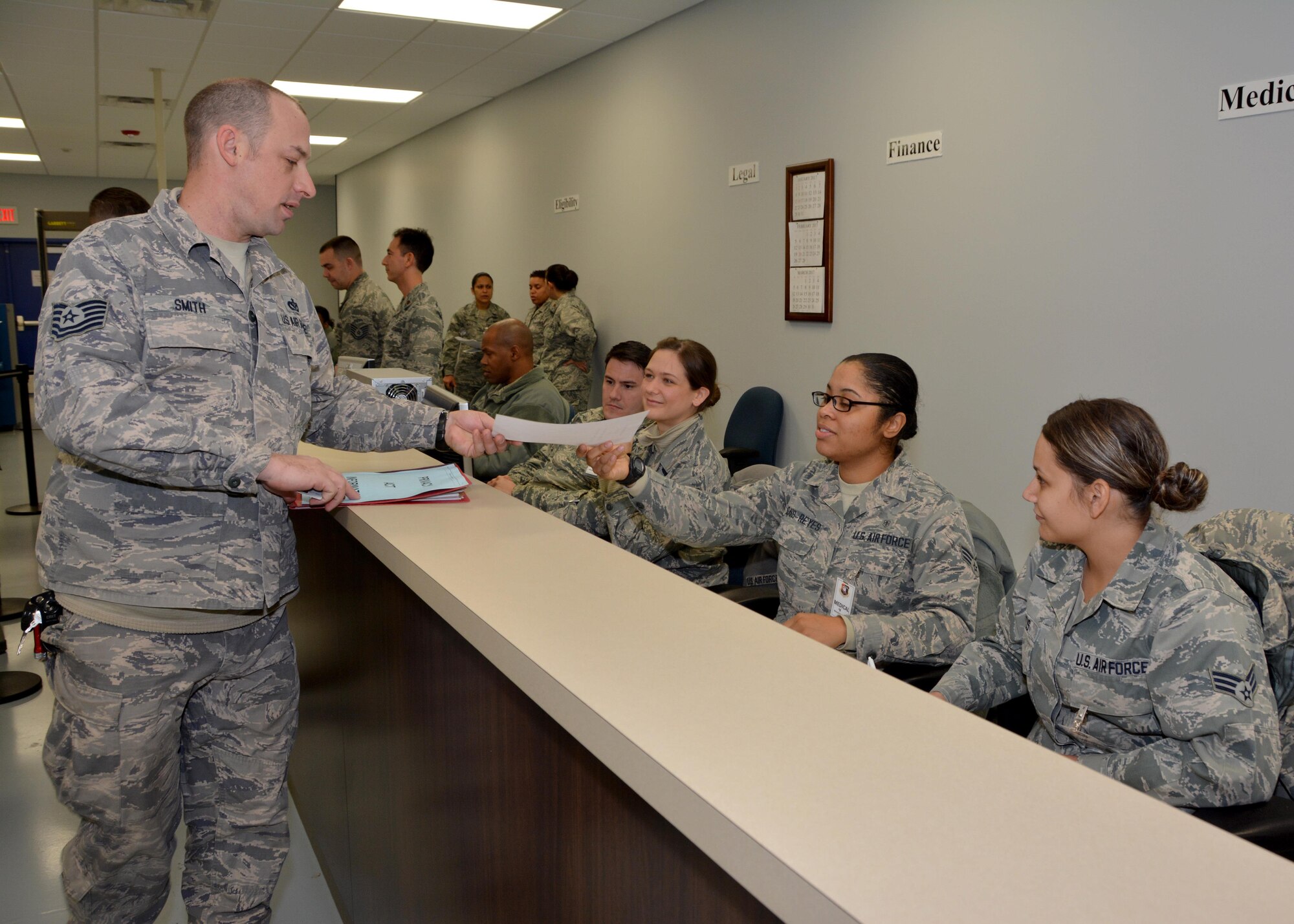 Senior Airman Ashley Davis-Reyes (seated), a medical technician with the 507th Medical Squadron, verifies deployment requirements for Tech. Sgt. Dustin Smith of the 507th Civil Engineer Squadron during an exercise mobility processing line Jan. 8, 2017, at Tinker Air Force Base, Okla. Reservists participated in the exercise in preparation for the upcoming nuclear operational readiness inspection in March 2016. (U.S. Air Force photo/Tech Sgt. Lauren Gleason)