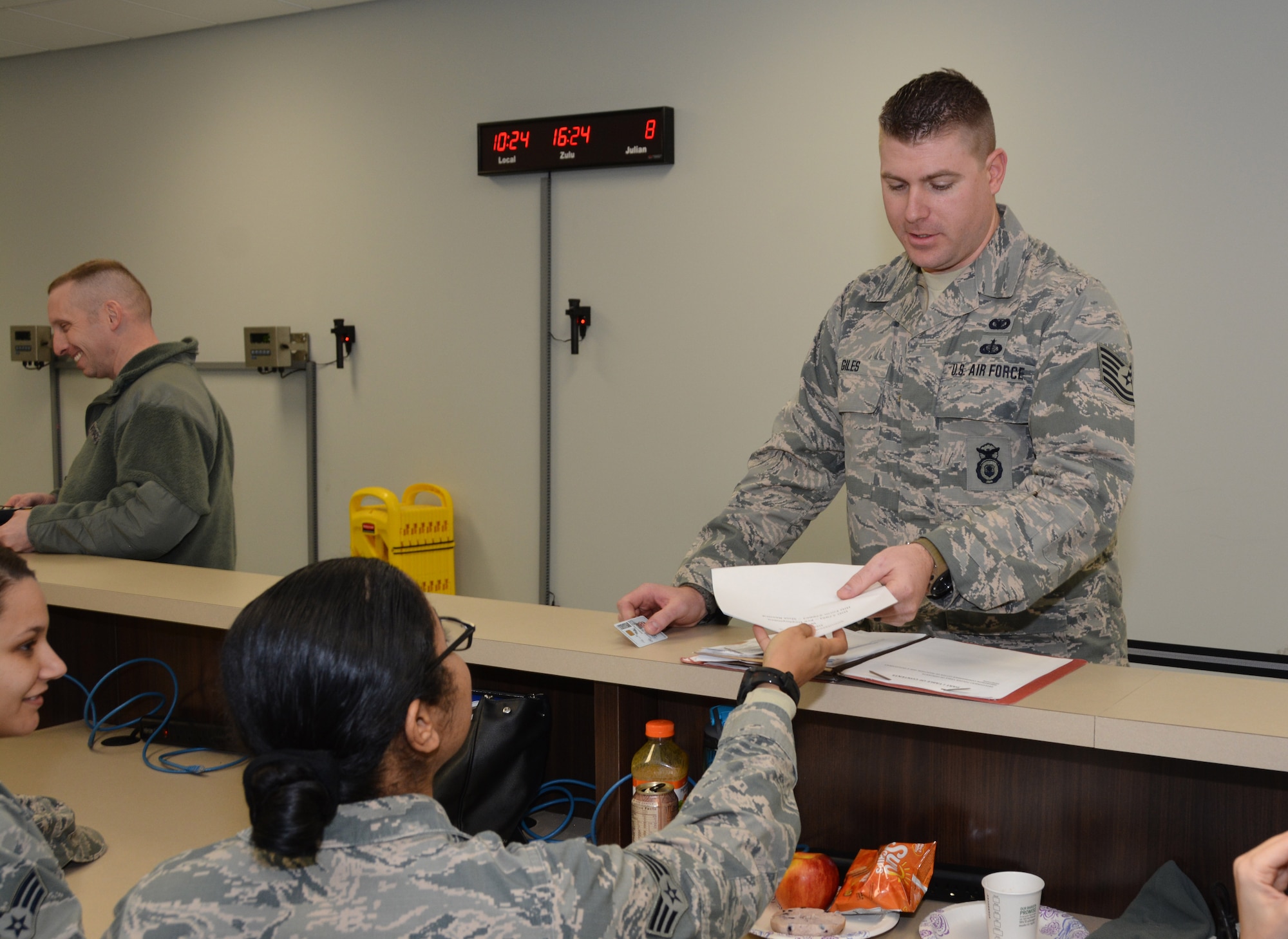 Tech. Sgt. Kevin Giles of the 507th Security Forces Squadron submits his medical paperwork while processing the mobility line during an exercise Jan. 8, 2017, at Tinker Air Force Base, Okla. Reservists with the 507th Air Refueling Wing participated in the exercise in preparation for the upcoming nuclear operational readiness inspection in March 2016. (U.S. Air Force photo/Tech Sgt. Lauren Gleason)