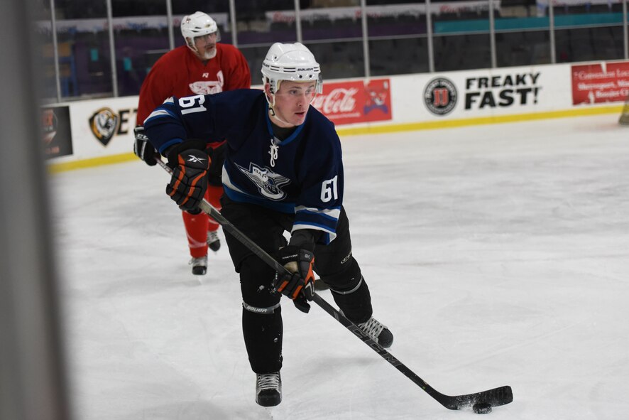 Keith Sullivan, Barksdale Bombers forward, skates with the puck at Hirsch Coliseum in Shreveport, La., Jan. 8, 2017. The only time the Bombers trailed the Red Team was in the first period. (U.S. Air Force photo/Airman 1st Class Alexis Schultz)