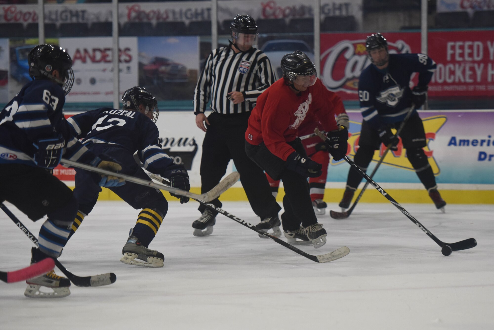 Barksdale Bomber defenders rally to prevent a goal in the third period at Hirsch Coliseum in Shreveport, La., Jan. 8, 2017. The Bombers held the Red Team to 13 goals, which was enough to keep the Bombers undefeated in the season. (U.S. Air Force photo/Airman 1st Class Alexis Schultz)