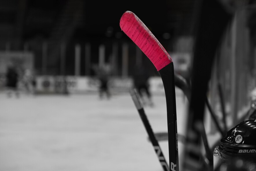 A Barksdale Bomber’s player holds their hockey stick while watching a game at Hirsch Coliseum in Shreveport, La., Jan. 8, 2017. Their sticks are taped for a better grip and the blade to protect it from wearing. (U.S. Air Force photo illustration/Airman 1st Class Stuart Bright)