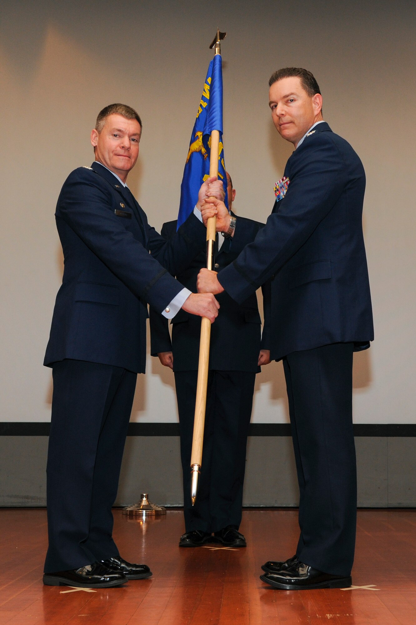 Col. Roderick T. Grunwald relinquishes command of the 940th Mission Support Group to Col. Craig C. Peters, 940th Air Refueling Wing commander at a change of command ceremony Jan. 7, 2017, at Beale Air Force Base, California. Grunwald served as the 940 MSG commander for about a year and a half. (U.S. Air Force photo by Senior Airman Tara R. Abrahams)
