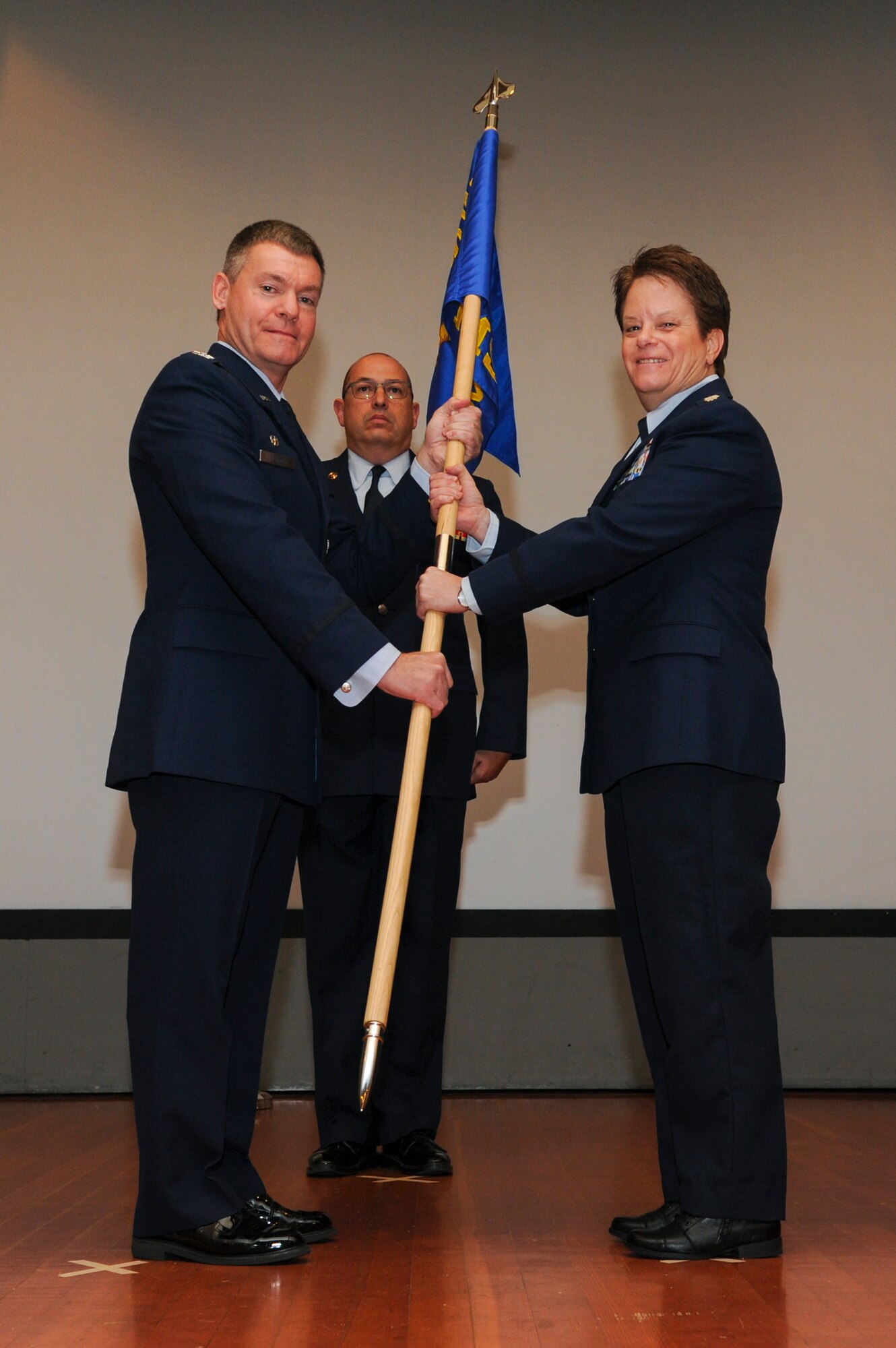 Lt. Col. Maureen H. McAllen receives the squadron guidon, as she assumes command of the 940th Mission Support Group, from Col. Craig C. Peters, 940th Air Refueling Wing commander, during a change of command ceremony Jan. 7, 2017, at Beale Air Force Base, California. A change of command ceremony is a long standing military tradition dating back to the Middle Ages that formally recognizes the transfer of authority from one commanding officer to another. (U.S. Air Force photo by Senior Airman Tara R. Abrahams)