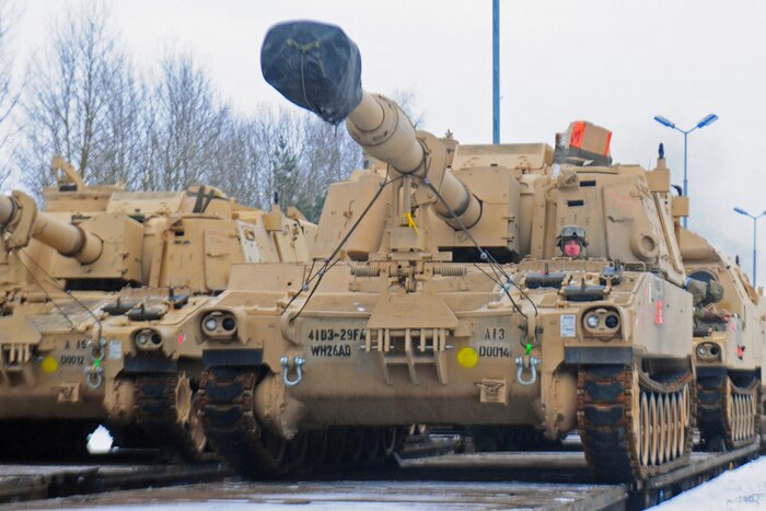 An American soldier drives an M109 Paladin self-propelled howitzer off of a flatcar in Drawsko Pomorskie, Poland, Jan. 9, 2017. The howitzer was one of 53 vehicles that arrived in Northeastern Poland from the Port of Bremerhaven, Germany, as part of Operation Atlantic Resolve. Army photo by Staff Sgt. Corinna Baltos