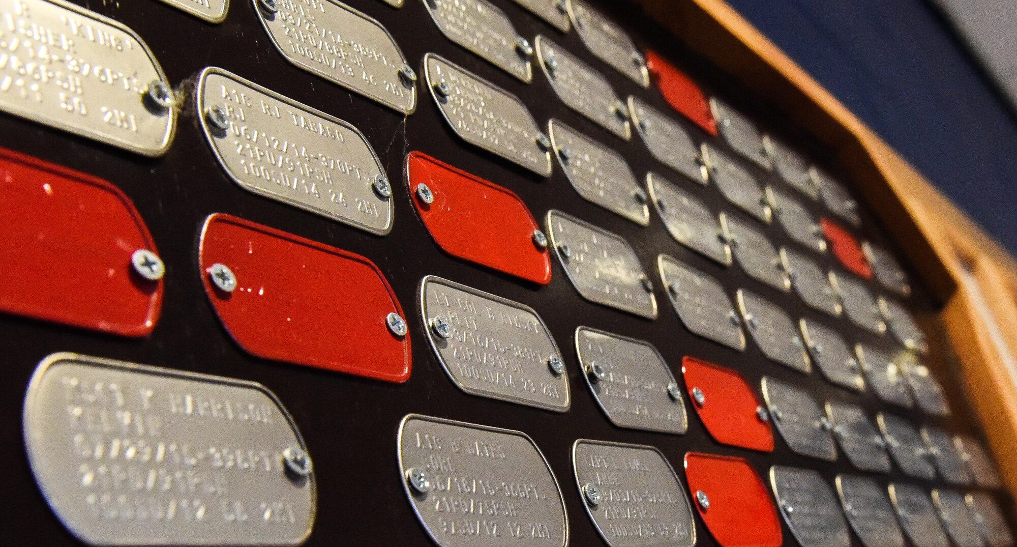 A plaque displays all the Iron Airman winners at the SrA Bryan Bell Fitness Center on Barksdale Air Force Base, La., Jan. 10, 2017. The Iron Airman challenge consists of a two mile run, pushups, pull ups and situps. All exercises must be completed within a 30 minute time period. (U.S. Air Force photo/ Senior Airmen Luke Hill)