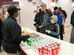 Master Sgt. Robert Bedwell, Air National Guard Bureau Command Post training and standardization manager, and his son, Connor, place an order with Shavown Brown, movie theater attendant, at the base movie theater concession area at Joint Base Andrews, Md., Dec. 16, 2016. During the fall of 2016, the theater was renovated with a concession area, audio and visual equipment, bathroom tiling and a heating, ventilation and air conditioning system. (U.S. Air Force photo by Staff Sgt. Joe Yanik)