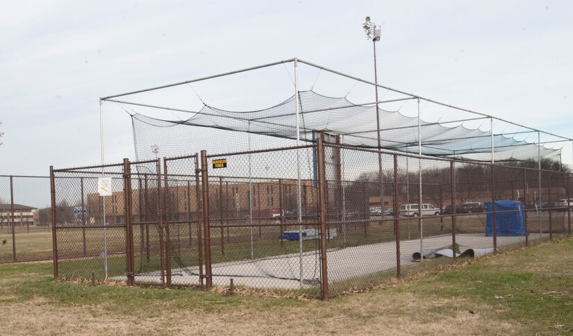 A newly-constructed batting cage is positioned between the basketball court and baseball diamond at Joint Base Andrews, Md. The recreational equipment is operational year round. (U.S. Air Force photo by Staff. Sgt. Joe Yanik)