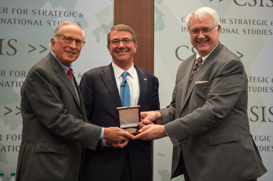 Defense Secretary Ash Carter (center) receives the Sam Nunn National Security Leadership Prize from Sam Nunn (left), former Senator and Chairman Emeritus of the Center for Strategic and International Studies, and John J. Hamre (right), president and CEO of CSIS, in Washington, D.C., Jan. 11, 2017. DOD photo by Army Sgt. Amber I. Smith