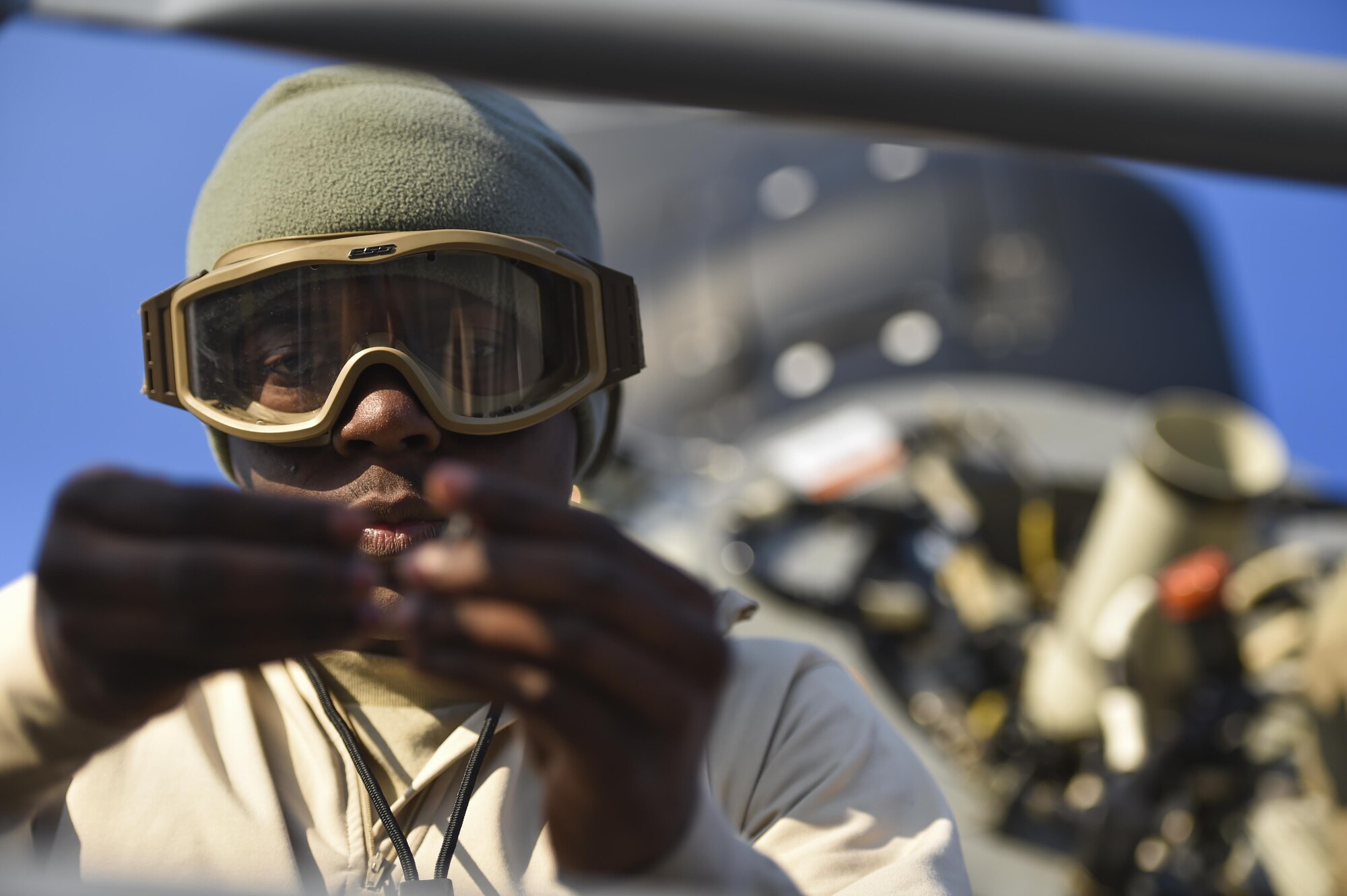 Staff Sgt. Roland Garrett, a crew chief with the 801st Special Operations Aircraft Maintenance Squadron, inspects aircraft parts during routine maintenance of a CV-22 Osprey tiltrotor aircraft at Hurlburt Field, Fla., Jan. 9, 2017. The 801st SOAMXS mission is to perform equipment maintenance in support of global special operations missions. (U.S. Air Force photo by Staff Sgt. Christopher Callaway)