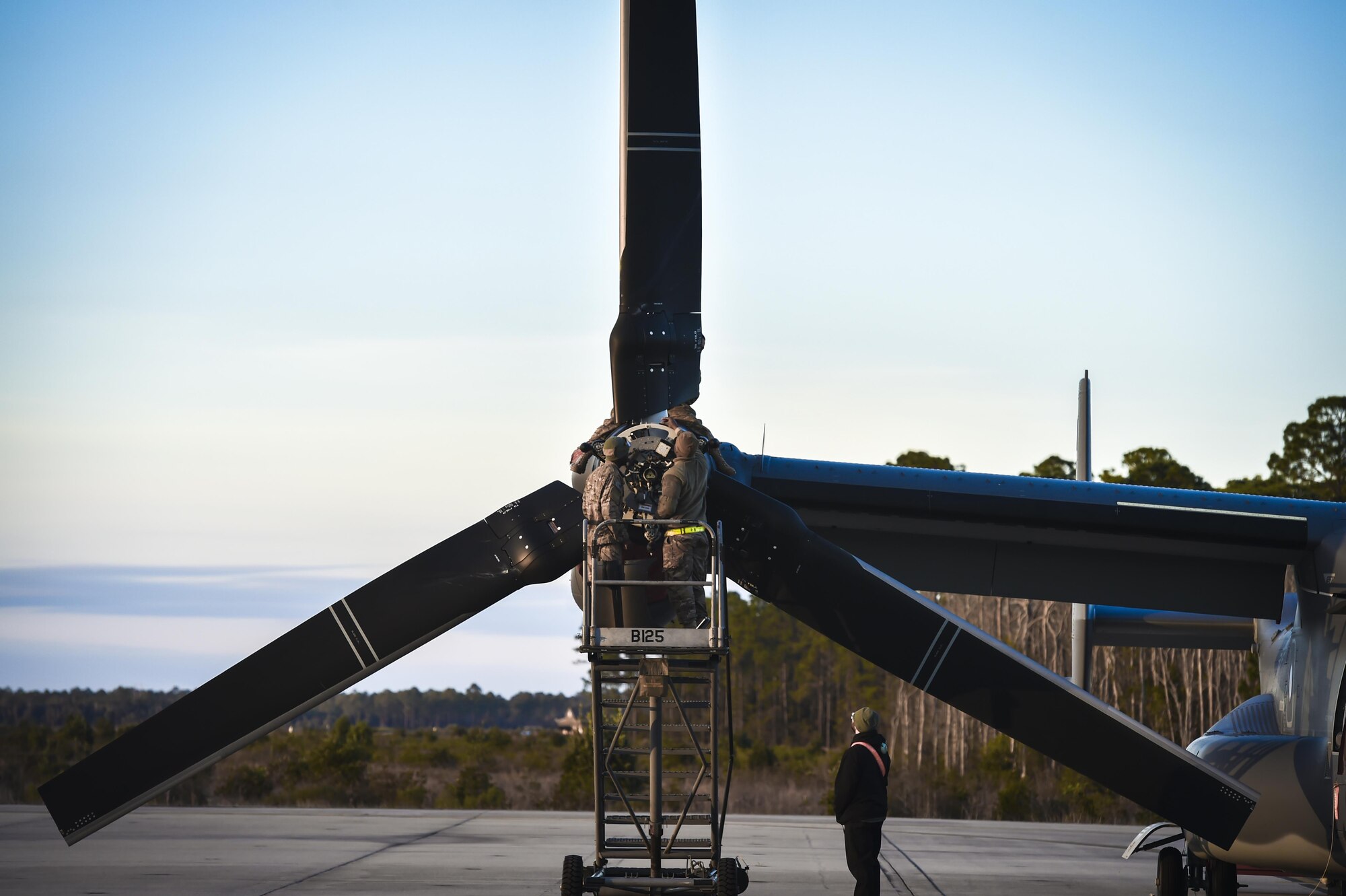 Airmen assigned to the 801st Special Operations Aircraft Maintenance Squadron perform routine maintenance on a CV-22 Osprey tiltrotor aircraft at Hurlburt Field, Fla., Jan. 9, 2017. The 801st SOAMXS provides regular maintenance for the Osprey assigned to the 8th Special Operations Squadron. (U.S. Air Force photo by Staff Sgt. Christopher Callaway)