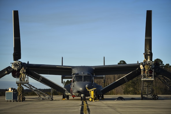 Crew chiefs assigned to the 801st Special Operations Aircraft Maintenance Squadron perform routine maintenance on a CV-22 Osprey tiltrotor aircraft at Hurlburt Field, Fla., Jan. 9, 2017. Crew chiefs supervise and coordinate care of their aircraft, such as detailed inspections, diagnosing malfunctions, replacing components and day-to-day maintenance. (U.S. Air Force photo by Staff Sgt. Christopher Callaway)