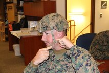 Gunnery Sgt. Orin Backlund with School of Infantry–East from Camp Lejeune, N.C., evaluate a helmet retention system during an Infantry Equipping Challenge limited user evaluation in December aboard Marine Corps Base Quantico, Va. The Infantry Equipping Challenge is an ongoing effort at Marine Corps Systems Command to leverage new and emerging technologies from industry to enhance the capability of Infantry Marines. (U.S. Marine Corps photo by Ashley Calingo)