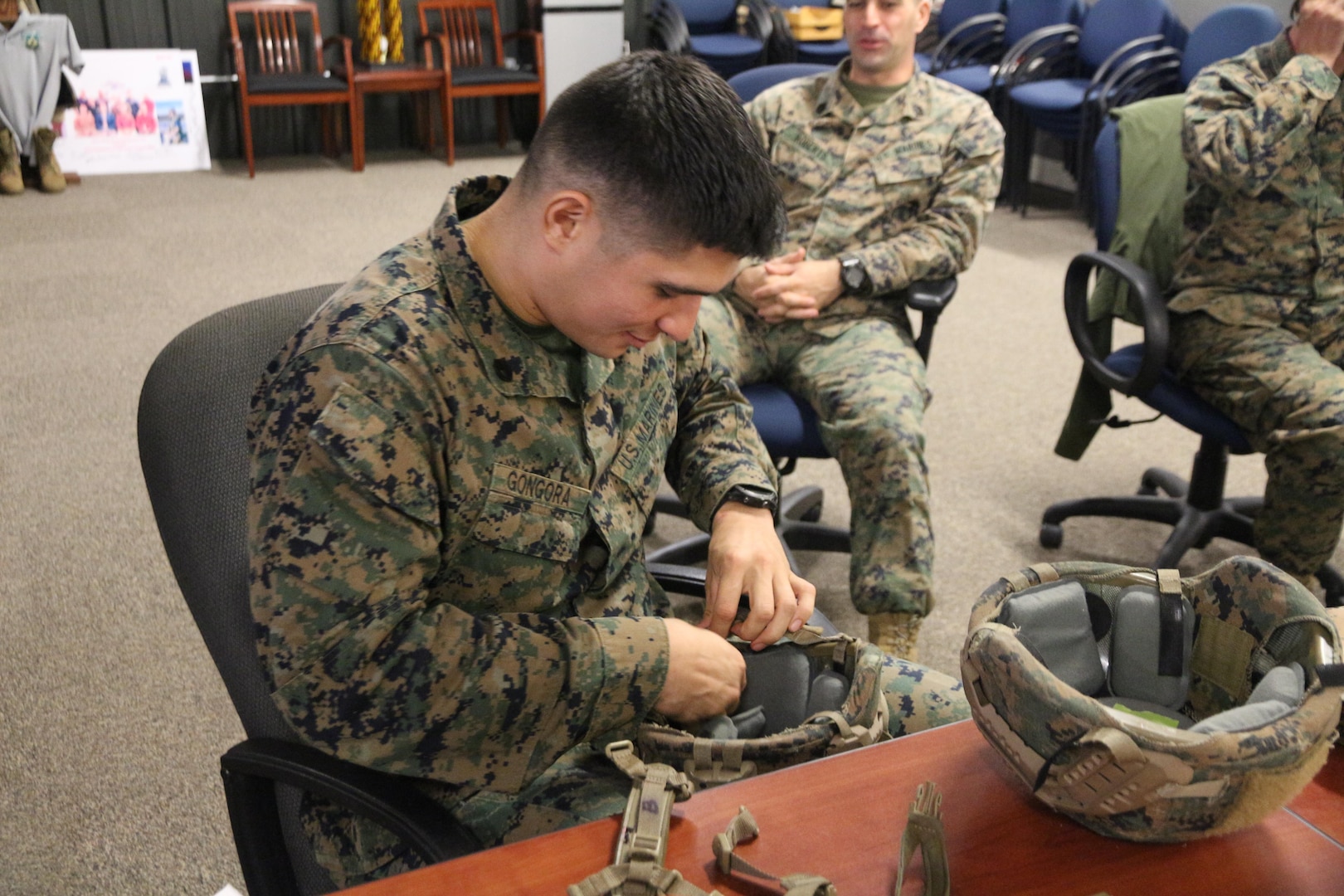 Staff Sgt. Aldo Gongora with School of Infantry–East from Camp Lejeune, N.C., evaluates a helmet retention system during an Infantry Equipping Challenge limited user evaluation in December aboard Marine Corps Base Quantico, Va. The Infantry Equipping Challenge is an ongoing effort at Marine Corps Systems Command to leverage new and emerging technologies from industry to enhance the capability of Infantry Marines. (U.S. Marine Corps photo by Ashley Calingo)