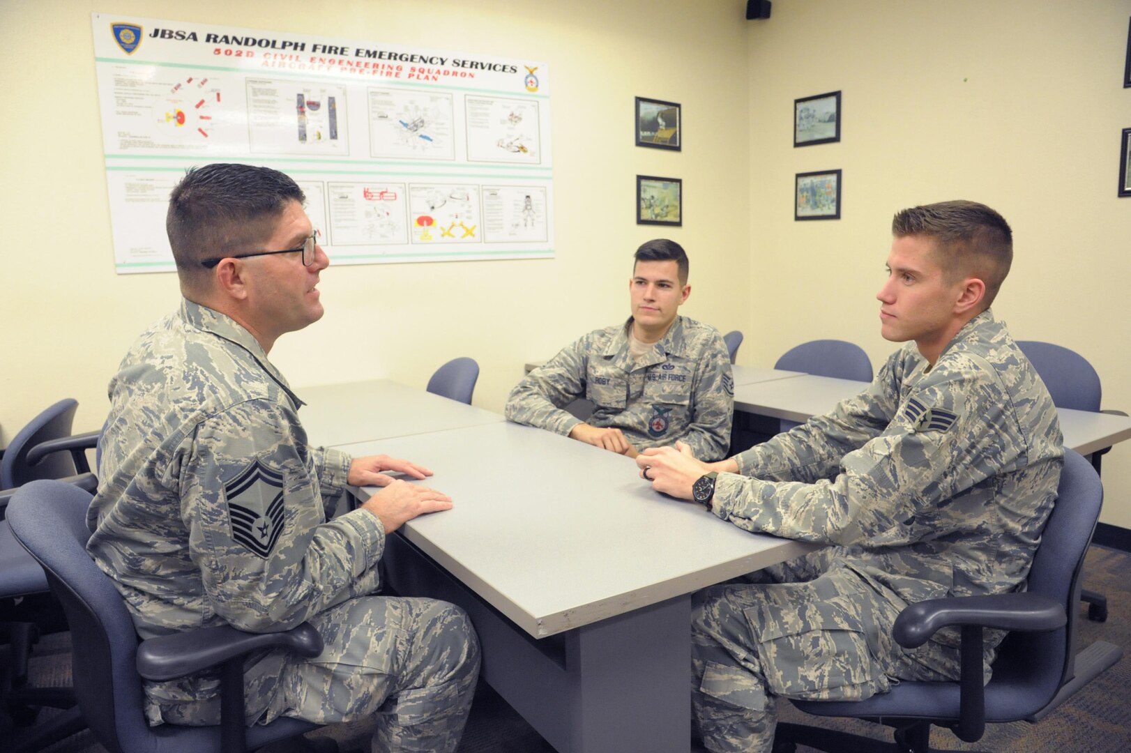 Senior Master Sgt. Lloyd Stinson, 502nd Air Base Wing, 902nd Security Forces Logistics Readiness Squadron, deputy fire chief, mentors Senior Airman Brice Haylett and Staff Sgt. Allen Roby at Joint Base San Antonio-Randolph, Jan. 11.  Mentoring is a critical component for members of the Air Force. It is normally a relationship in which a person with greater experience and wisdom guides another person to develop both personally and professionally.