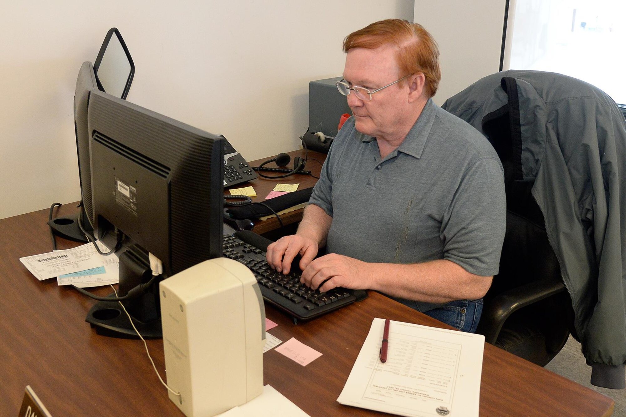 David Lavelle, Property Disposal Technician with Defense Logistics Agency Disposition Services, processes forms during the turn-in and disposal of unwanted government property Jan. 4 Hill Air Force Base, Utah. DLA Disposition Services at Hill AFB is the central collection point of unwanted or no longer needed government property. (U.S. Air Force photo by Todd Cromar)