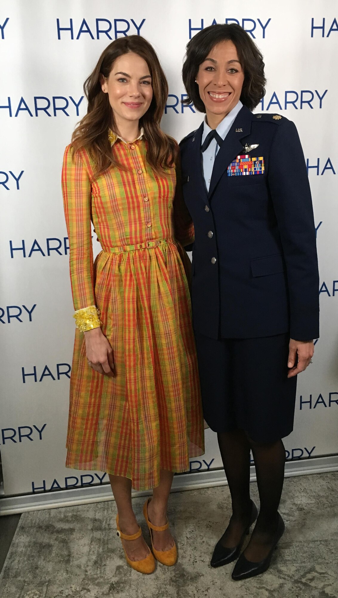Maj. Christina Hopper, an Air Force Reserve F-16 pilot from Vance Air Force base, Oklahoma, poses with actress Michelle Monaghan during the taping of NBC's daytime show "Harry." 
