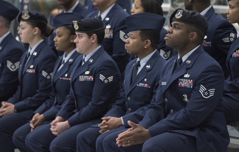 Airmen acting as ushers during the farewell ceremony for the secretary of the Air Force view the event at Joint Base Andrews, Md., Jan. 11, 2017. Ushering was one of the duties performed by 11th Wing Airmen who volunteered to assist in the ceremony. (U.S. Air Force photo by Senior Airman Jordyn Fetter)