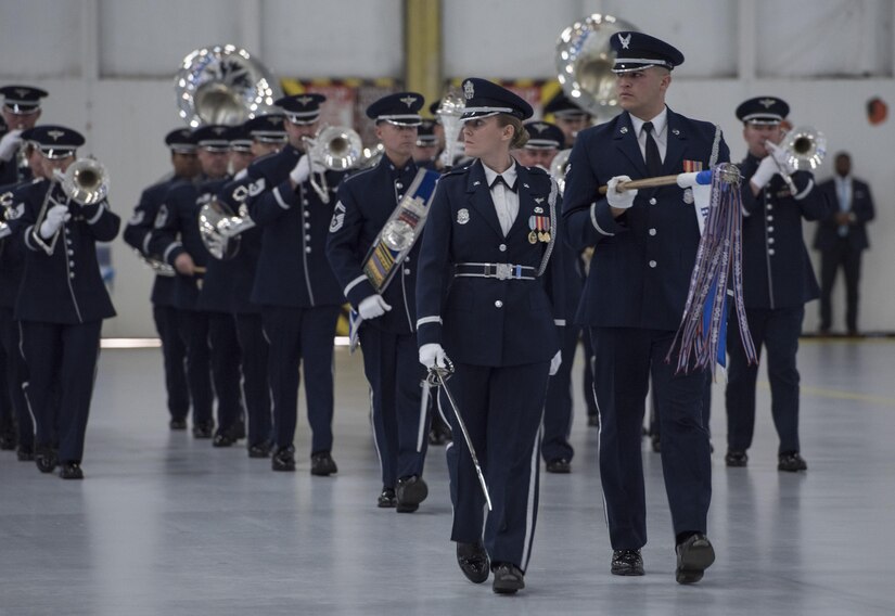 The U.S. Air Force Band and Honor Guard perform a pass and review during the farewell ceremony for Secretary of the Air Force Deborah Lee James at Joint Base Andrews, Md., Jan. 11, 2017. The event hosted many distinguished visitors who witnessed the time-honored farewell tradition. During the ceremony, Secretary of Defense Ash Carter and Air Force Chief of Staff Gen. David L. Goldfein provided remarks and the U.S. Air Force Band and Honor Guard performed a musical tribute. (U.S. Air Force photo by Senior Airman Jordyn Fetter)