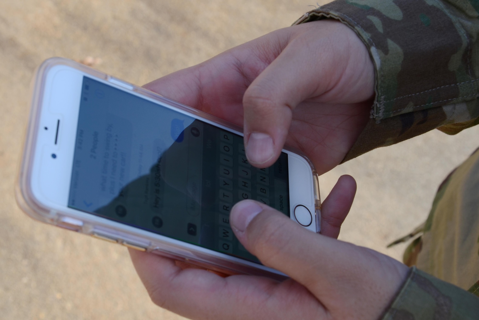 U.S. Air Force Senior Airman Diana Cossaboom, U.S. Air Forces Central Command Public Affairs functional area manager, texts with a friend at Shaw Air Force Base, S.C., Jan. 12, 2017. Texts are one form of communication perpetrators use to extort money from Airmen who have been a victim of sextortion. In the past three years, the Air Force Office of Special Investigations has recorded around 40 victims of this scam. (U.S. Air Force photo by Tech. Sgt. Amanda Dick)