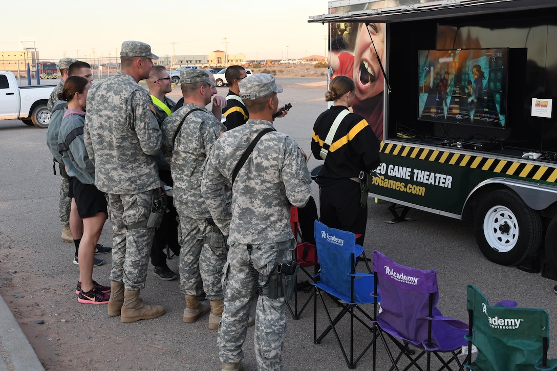 Soldiers play video games during “Party in the Desert,” an event hosted by the 642nd Regional Support Group and the USO, at McGregor Range, N.M., Dec. 12, 2016.