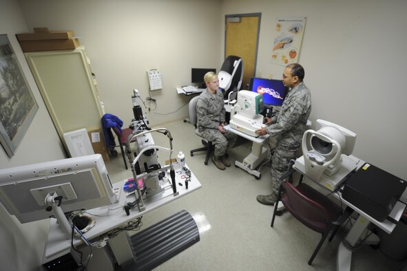 A patient, left, and Airman 1st Class Pratick Bhatt, an optometry technician with the 1st Special Operations Medical Group, prepare for an eye examination at the 1st Special Operations Medical Group Optometry Office at Hurlburt Field, Fla., Jan. 9, 2017. The optometry office performs several check-up tasks including vision, intraocular pressure and slit lamp exams. (U.S. Air Force photo by Airman Dennis Spain)