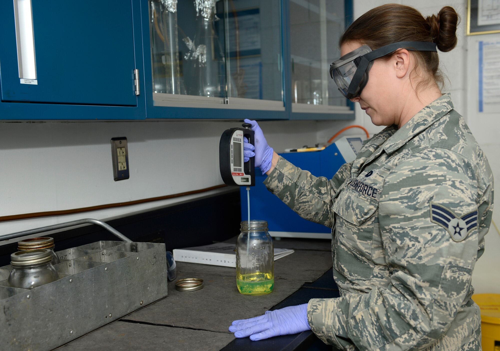 U.S. Air Force Senior Airman Brittany Litton, 733rd Logistics Readiness Squadron fuels laboratory technician, tests the quality of diesel fuel at Joint Base Langley-Eustis, Va., Jan. 6, 2017. The laboratory uses multiple tests and equipment to ensure the highest quality product is provided to the 1st Fighter Wing and their mission partners. (U.S. Air Force photo by Airman 1st Class Kaylee Dubois)