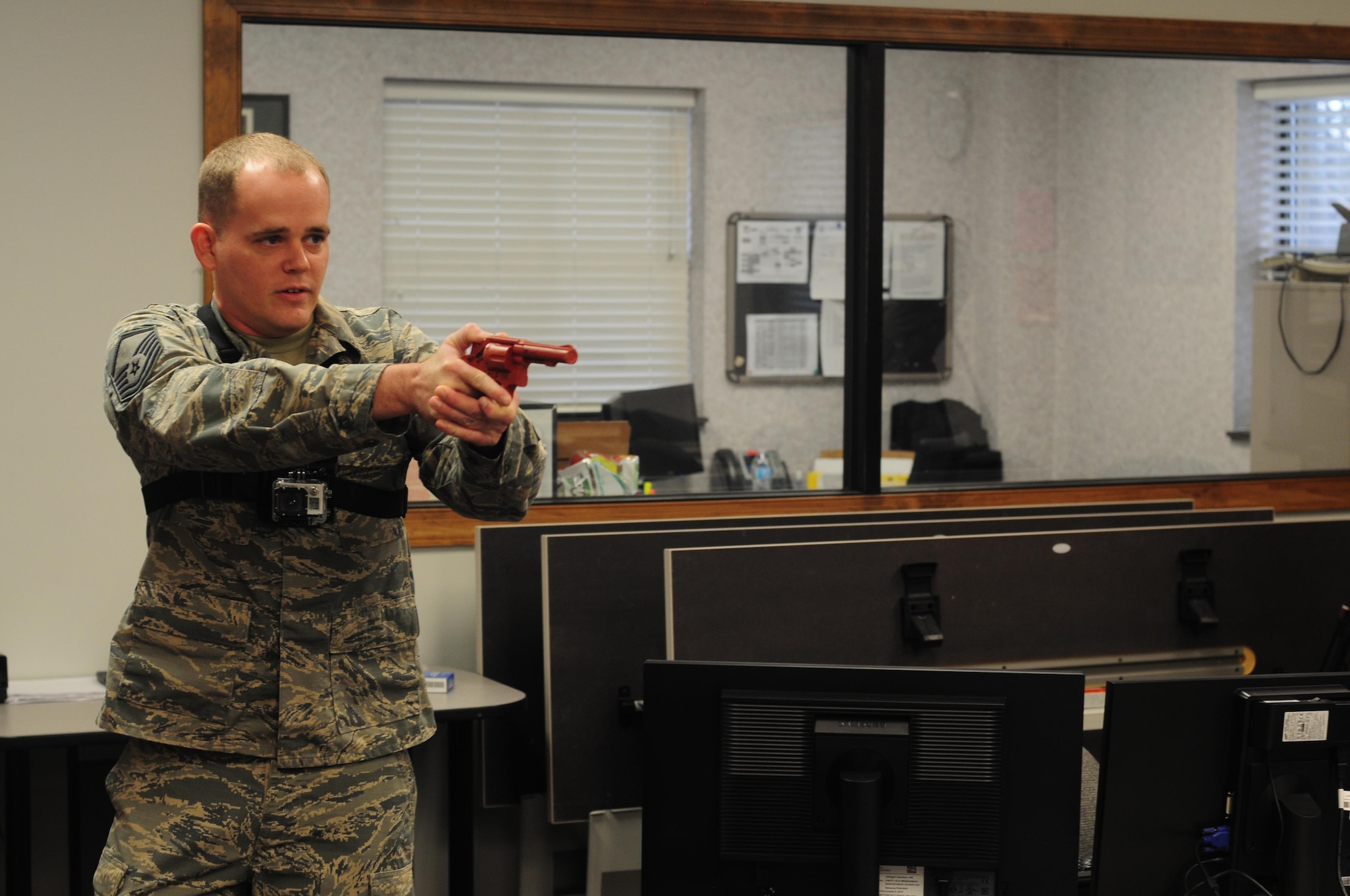 Master Sergeant Steven Shiflett, 916th Air Refueling Wing inspections superintendent simulates an “active shooter” during an exercise on Jan. 11, 2017, at Seymour Johnson Air Force Base, North Carolina. (U.S. Air Force photo by Senior Airman Jeramy Moore.)