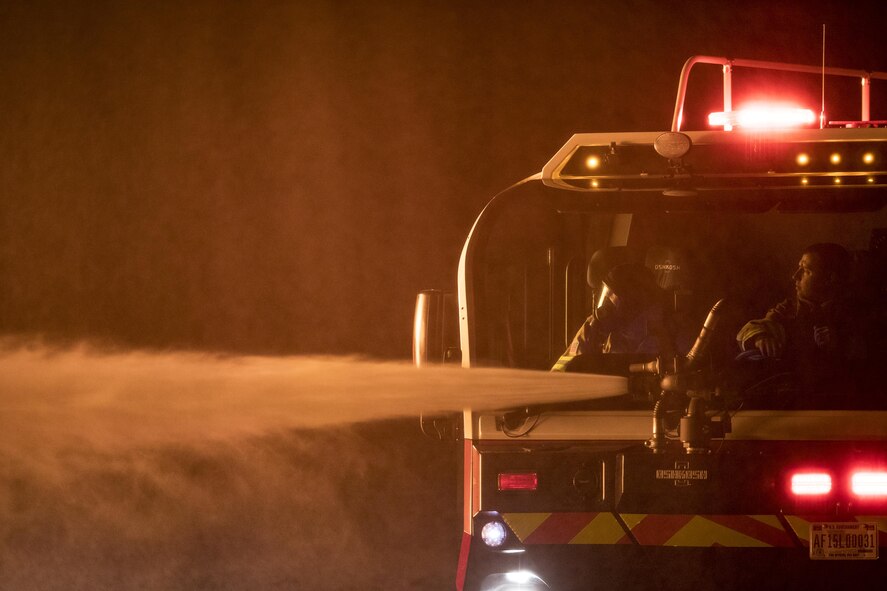 Firefighters from the 23d Civil Engineer Squadron use a P-23 Airport Rescue Fire Fighting vehicle during nighttime, live-fire training, Jan. 10, 2017, at Moody Air Force Base, Ga. The P-23 is primarily used to respond to aircraft fuel fires using its 3,300 gallons of water, 500 gallons of fire-retardant foam and 500lbs of dry powder. There are 250 P-23s in the Air Force inventory across active duty, Air National Guard and Air Force Reserve bases. (U.S. Air Force photo by Staff Sgt. Ryan Callaghan)
