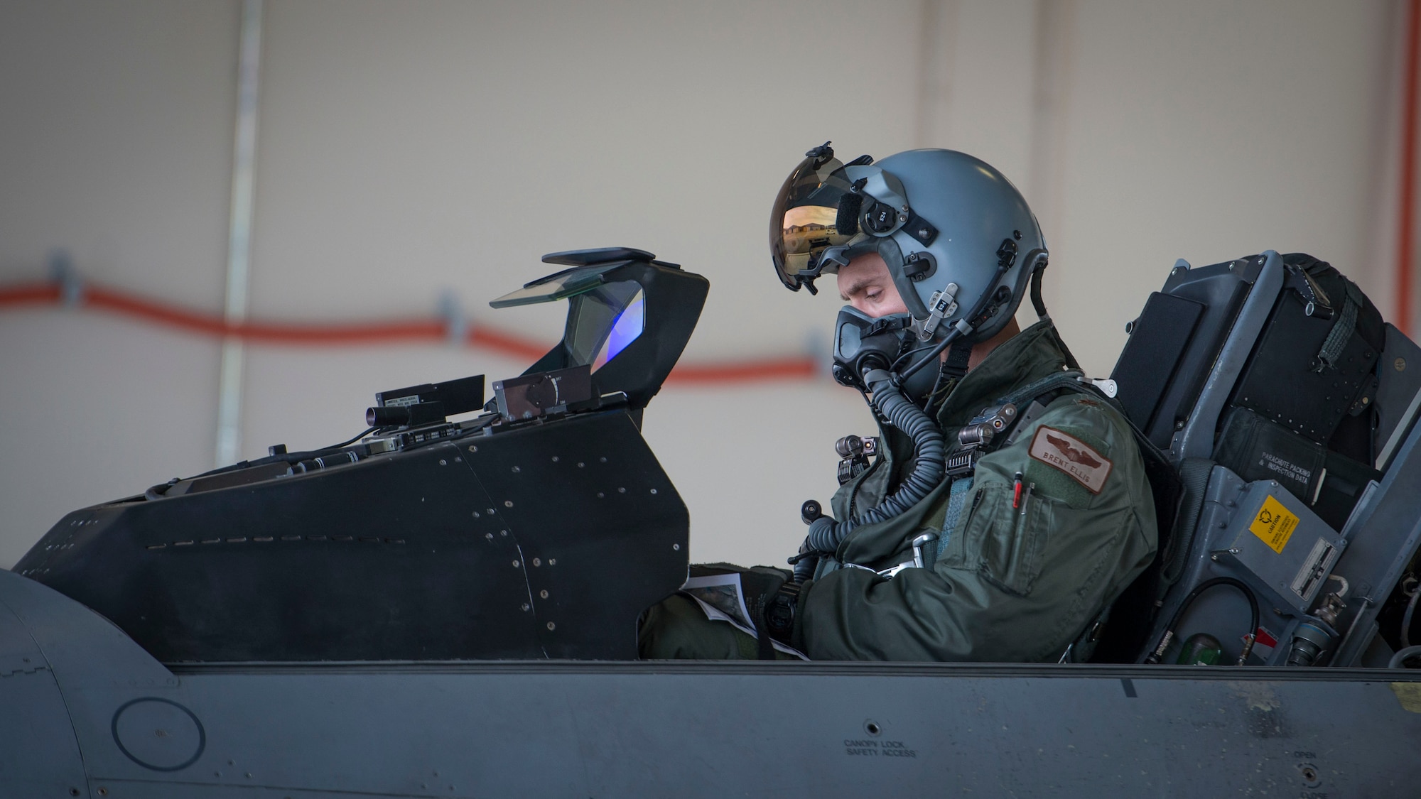 Maj. Brent Ellis, a fighter pilot with the 311th Fighter Squadron, performs pre-flight checks prior to a flight at Holloman Air Force Base, N.M., on Jan. 9, 2017. Ellis flew Brig. Gen. Eric Sanchez, the Commanding General at White Sands Missile Range, on a familiarization flight in an F-16 Fighting Falcon, to demonstrate Holloman’s F-16 mission, and the aircraft’s capabilities. (U.S. Air Force photo by Airman 1st Class Alexis P. Docherty)