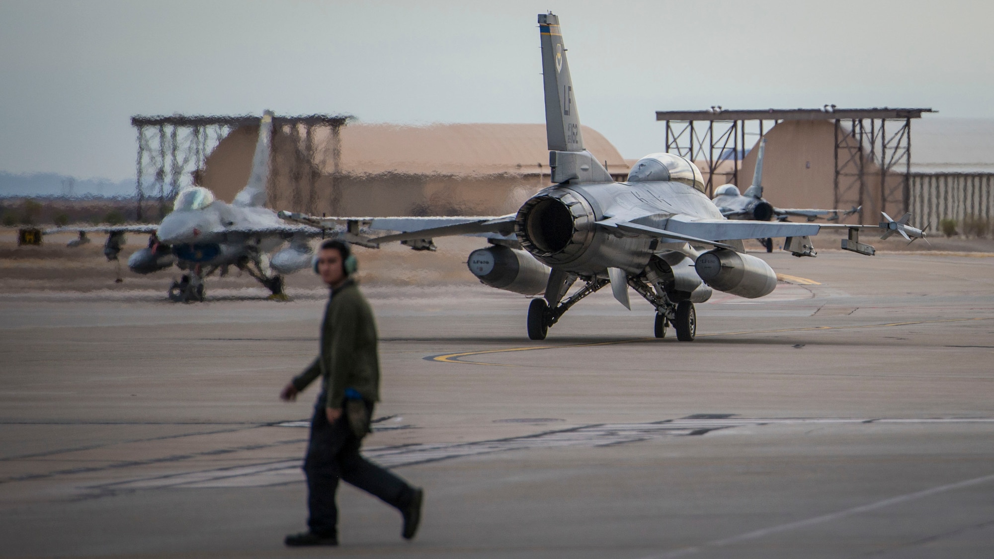 An F-16 Fighting Falcon piloted by Maj. Brent Ellis, a fighter pilot with the 311th Fighter Squadron, heads toward the flight line at Holloman Air Force Base, N.M., on Jan. 9, 2017. Ellis flew Brig. Gen. Eric Sanchez, the Commanding General at White Sands Missile Range, on a familiarization flight to demonstrate Holloman’s F-16 mission and the aircraft’s capabilities. (U.S. Air Force photo by Airman 1st Class Alexis P. Docherty)