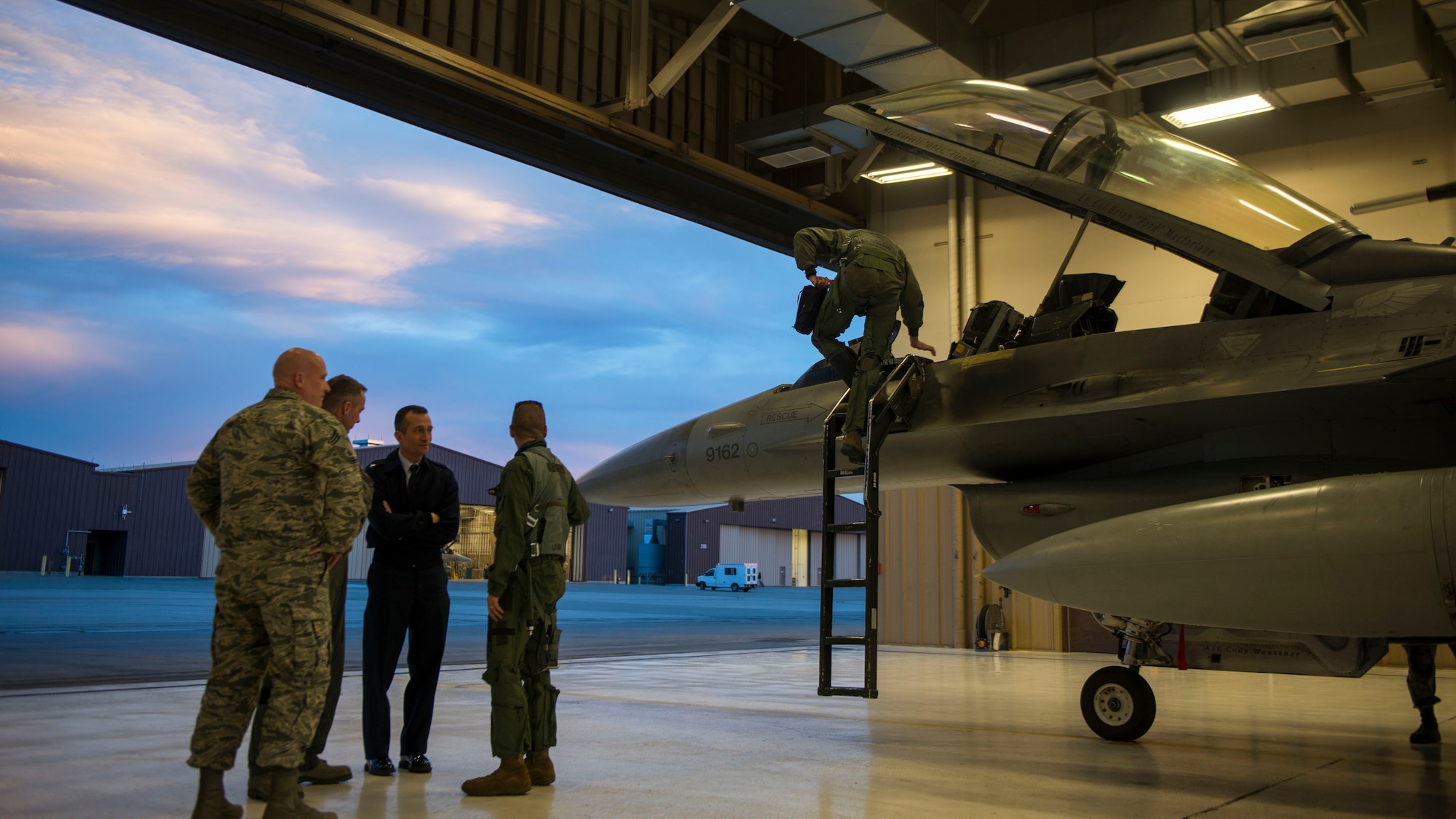 Chief Master Sgt. Vincent Miller (left), the 54th Fighter Group chief, Col. James Keen (left-center), the 54th FG commander, and Col. Houston Cantwell (right-center), the 49th Wing commander, meet with Brig. Gen. Eric Sanchez (right), the Commanding General at White Sands Missile Range and Maj. Brent Ellis, a fighter pilot with the 311th Fighter Squadron (far-right), after their flight in an F-16 Fighting Falcon, at Holloman Air Force Base, N.M., on Jan. 9, 2017. Sanchez visited Holloman AFB to attend an airspace and mission brief related to Holloman and WSMR’s ongoing partnership. Sanchez was offered a familiarization flight on the F-16 to gain a better understanding of the aircraft’s mission and its capabilities. (U.S. Air Force photo by Airman 1st Class Alexis P. Docherty)