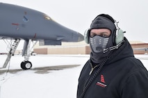 John Bishop, a B-1B mechanic with the 567th Aircraft Maintenance Squadron, wears a neoprene face mast during a B-1B Lancer engine run after the first significant snowfall Oklahoma City has received this season, Jan. 6, 2017, tinker Air Force Base, Oklahoma. Despite the accumulation of snow the important maintenance operations conducted by the Oklahoma city Air Logistics Complex continued to ensure aircraft production stays on track to deliver capability to the warfighter. (U.S. Air Force photo/Greg L. Davis)