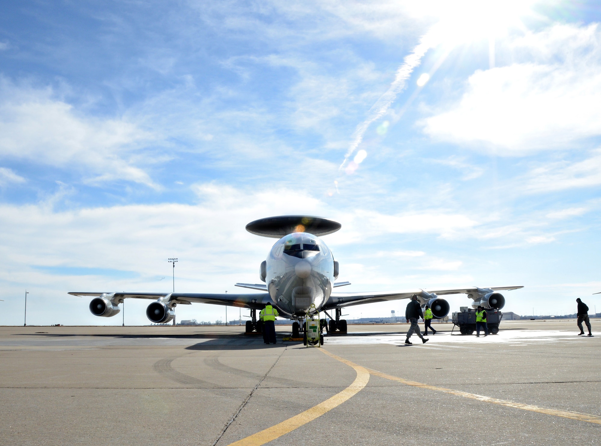 Ground crews secure the first E-3 Sentry aircraft to undergo glass flight deck modification, known as DRAGON (Diminishing Manufacturing Sources Replacement of Avionics for Global Operations and Navigation) which replaces 1970s analog technology with commercially viable digital flight management systems. (Air Force photo by Kelly White)