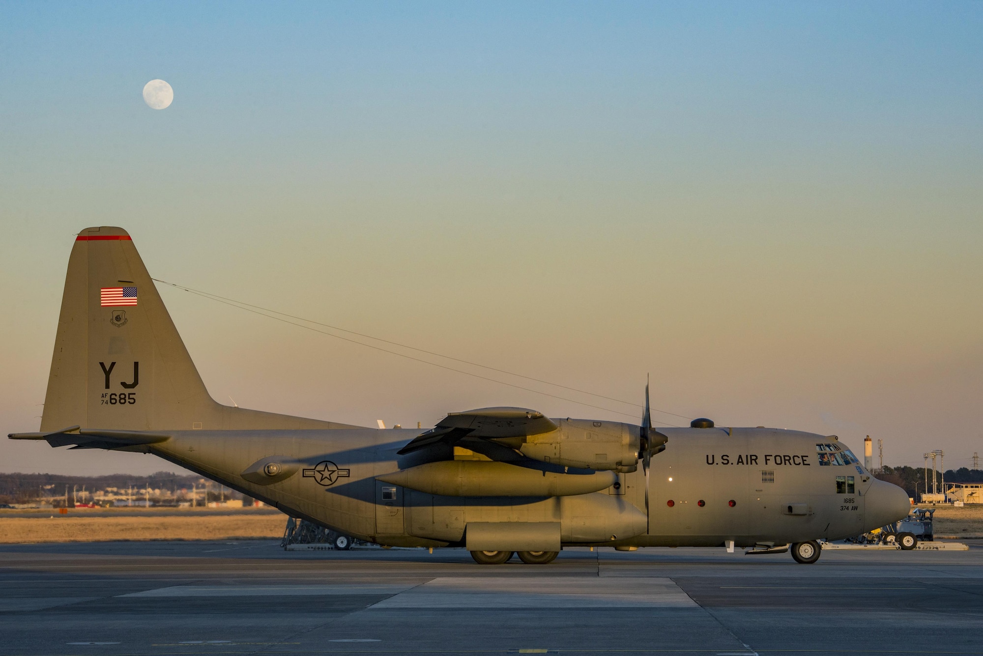 A C-130 Hercules prepares to park on the flight line after a day of personnel static line jump exercises on Jan. 11, 2017, at Yokota Air Base, Japan. Marines work with the 36th Airlift Squadron four times a year to help maintain jump qualifications and promote bilateral training. (U.S. Air Force photo by Airman 1st Class Donald Hudson)