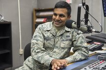 Airman 1st Class Dhruv Gopinath, American Forces Network Tokyo broadcaster, conducts an interview for a radio spot at Yokota Air Base, Japan, Jan. 9, 2017. Gopinath was one of five Airmen at Yokota to receive a promotion through the Senior Airman Below-the-Zone Promotion Board. (U.S. Air Force photo by Senior Airman David C. Danford)